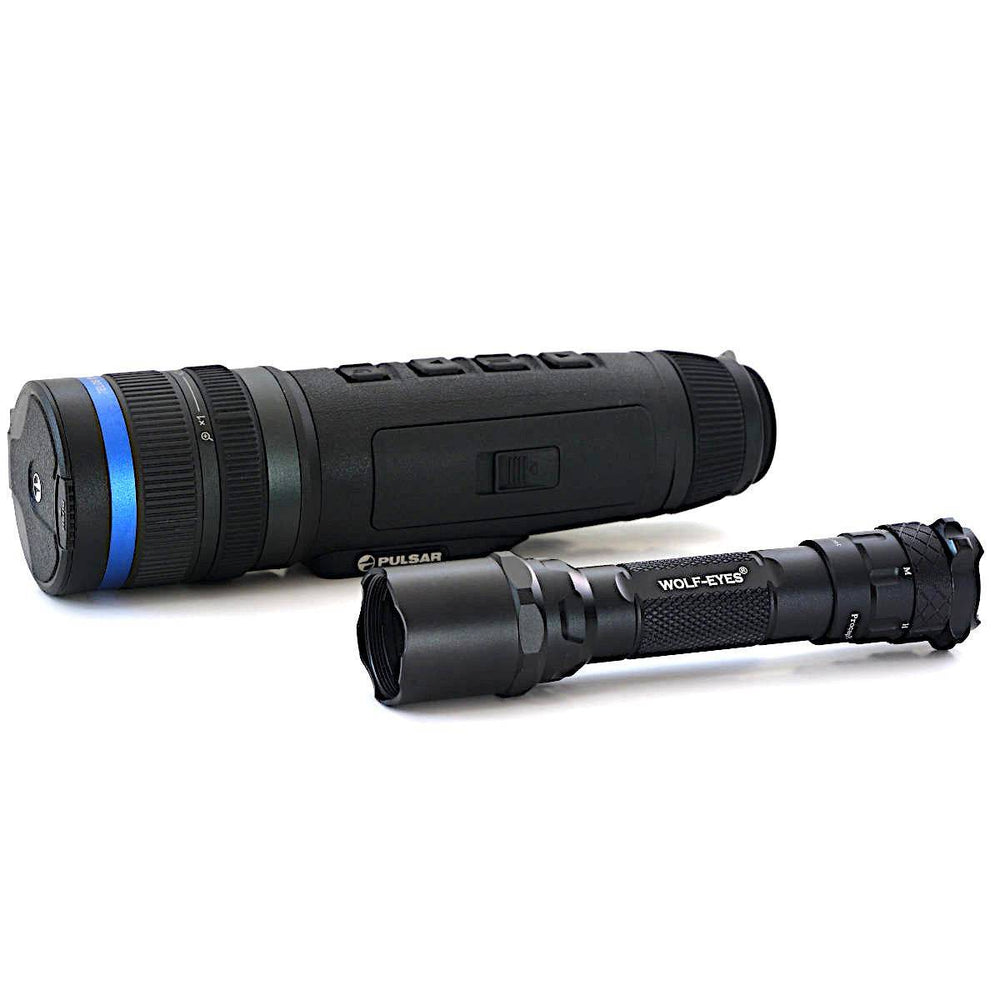 Pulsar Telos XQ35 LRF thermal monocular next to tactical flashlight, showcasing compact design and accessory compatibility.