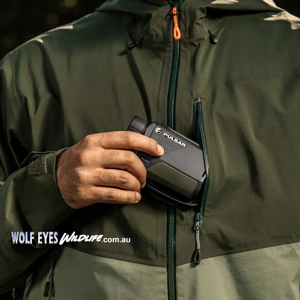Pulsar wildlife alaris xg30 thermal monocular showing small size as placed in rain jacket before looking for quolls